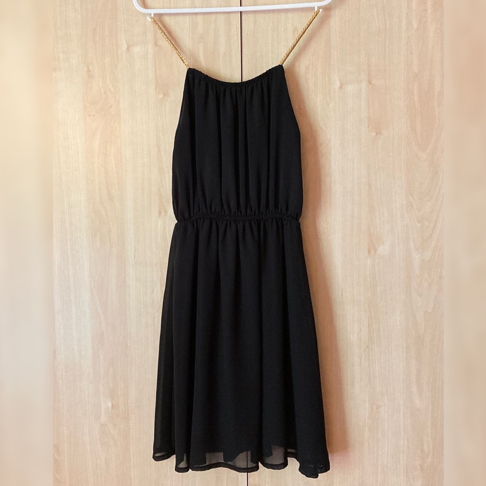 Mesh black dress with golden braided straps